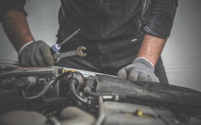 Professional Auto Mechanic Doing a Preventative Maintenance Check on a Vehicle