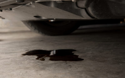 Vehicle leaking fluid onto a concrete floor needs maintenance