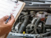 auto service expert checking off auto maintenance items on list